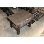 A rustic wooden low table