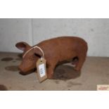 A small cast iron pig ornament