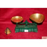 A set of early kitchen scales with brass pans and