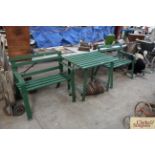 A pair of green painted wooden and metal two seat