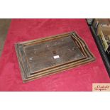 Three wooden graduated tea trays