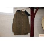 A military jacket with buttons and badges for the