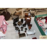 A quantity of dolls house furniture including tall