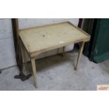 A vintage green painted folding bed table