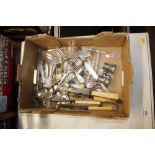 A box of various plated cutlery; and a pair of ope