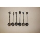 A set of six Islamic white metal coffee spoons