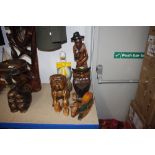 A collection of various carved wooden figures and