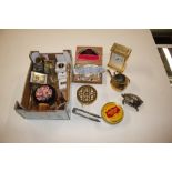 A box containing table lighters, stamps, a brass t