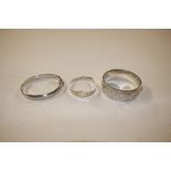 A collection of three silver bangles Hallmarked