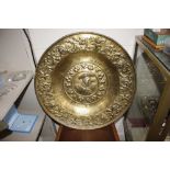 A large French 19th Century beaten brass alms dish