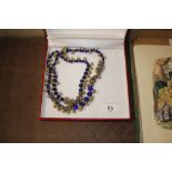 A boxed blue and gilt Indian style necklace