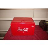 A reproduction Coca-Cola cool box