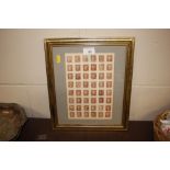 A framed and glazed sheet of penny red stamps