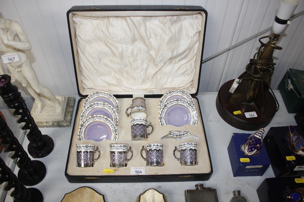 A case containing Aynsley porcelain coffee cans wi