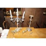 A plated candelabra; a large plated baluster candl