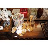 Two light oak candlesticks; a Teddy Bear; a wicker