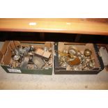 Two boxes containing various brass and silver plat