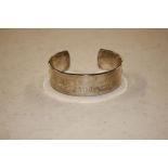 A Tiffany & Co white metal marked bracelet, dated 1997