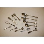 A bag containing various silver spoons, forks etc