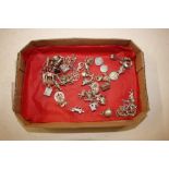 A box containing various silver and white metal ch