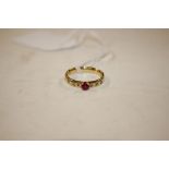 A 18ct gold diamond and red stone set ring, total