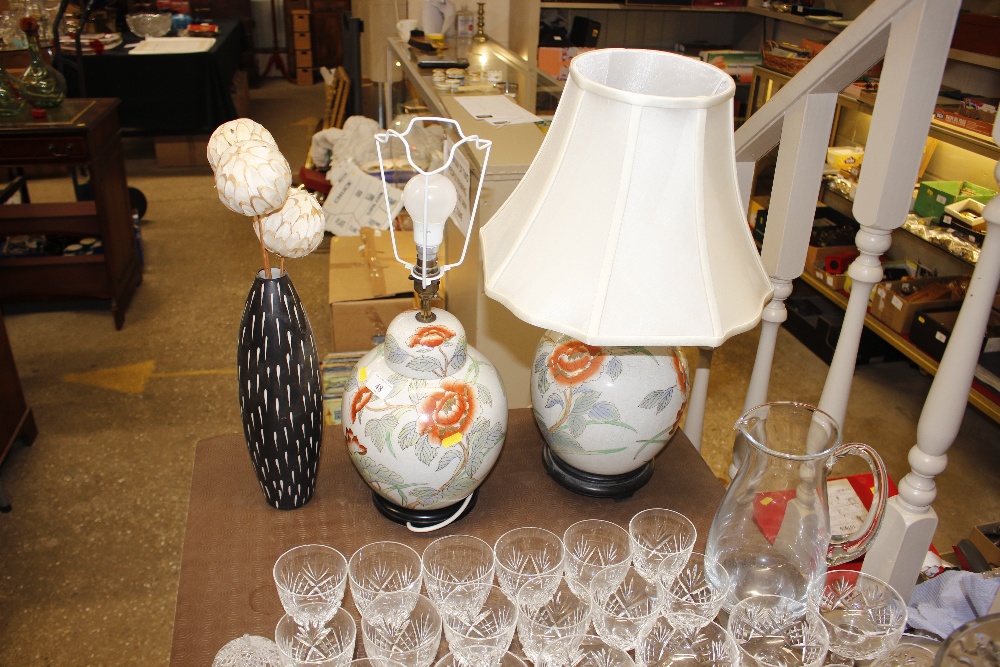 A pair of oriental style lamps and a vase