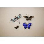 A white metal and blue enamel butterfly brooch; an