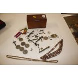 A box containing chain link necklace and various c