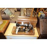 A Davis hand sewing machine in fitted case