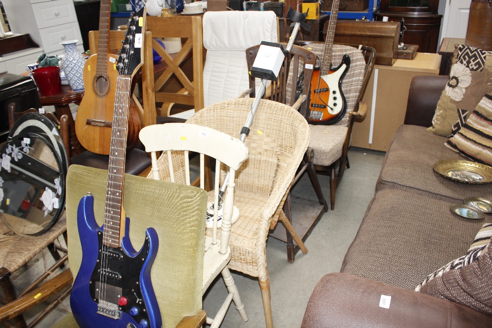 A wicker armchair together with a cream painted st