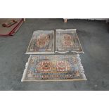 Three matching 3'7" x 2'3" wool rugs