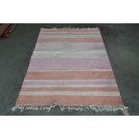 An approx. 4'5" x 6@ striped patterned rug