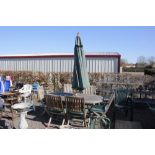 A Bramblecrest teak garden table with parasol, and