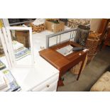 A Singer sewing machine in fitted table - sold as