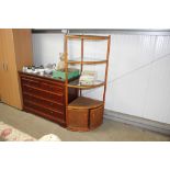 A cane four tier corner unit raised on cupboard ba