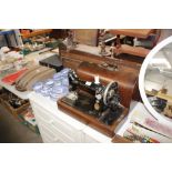 A Singer hand sewing machine in fitted case