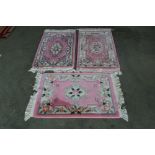 Three approx. 3'4" x 2' pink Chinese wool rugs