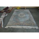 An approx. 9' x6' floral patterned Chinese wool ru