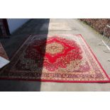A Wilton & Grosvenor Persian patterned carpet appr