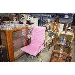 A pink swivel office chair