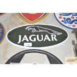 A cast metal Jaguar sign