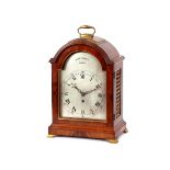 A 19th Century mahogany and brass bracket clock, by Amyot & Bennett Norwich, with silvered Roman