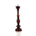 A pair of oak pricket candlesticks, with 17th Century elements having metal spikes and turned