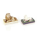 A 19th Century porcelain model of a recumbent lion; and a smaller similar heightened in gilt (2)