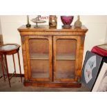 A 19th Century walnut and marquetry display cabinet, the interior shelves enclosed by a pair of