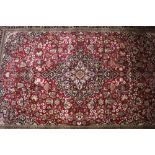 A Middle Eastern rug, of Kashan type multi floral decoration on a predominately blue and green