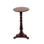 A 19th Century mahogany and brass mounted occasional table, the circular top raised on a turned