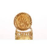 A 9ct gold ring, set with a 1903 half Sovereign approx. 10.gms total weight
