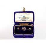 A 9ct gold and diamond set floral design bar brooch