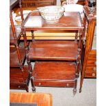 A 19th Century mahogany three tier what not, fitted single drawer to base raised on turned supports,